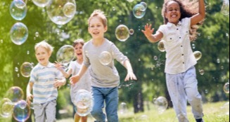 Small children with bubbles